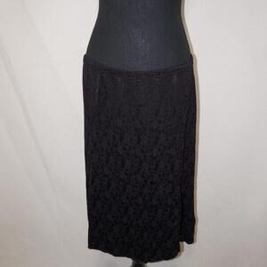 black CP Shades midi skirt with subtle floral pattern